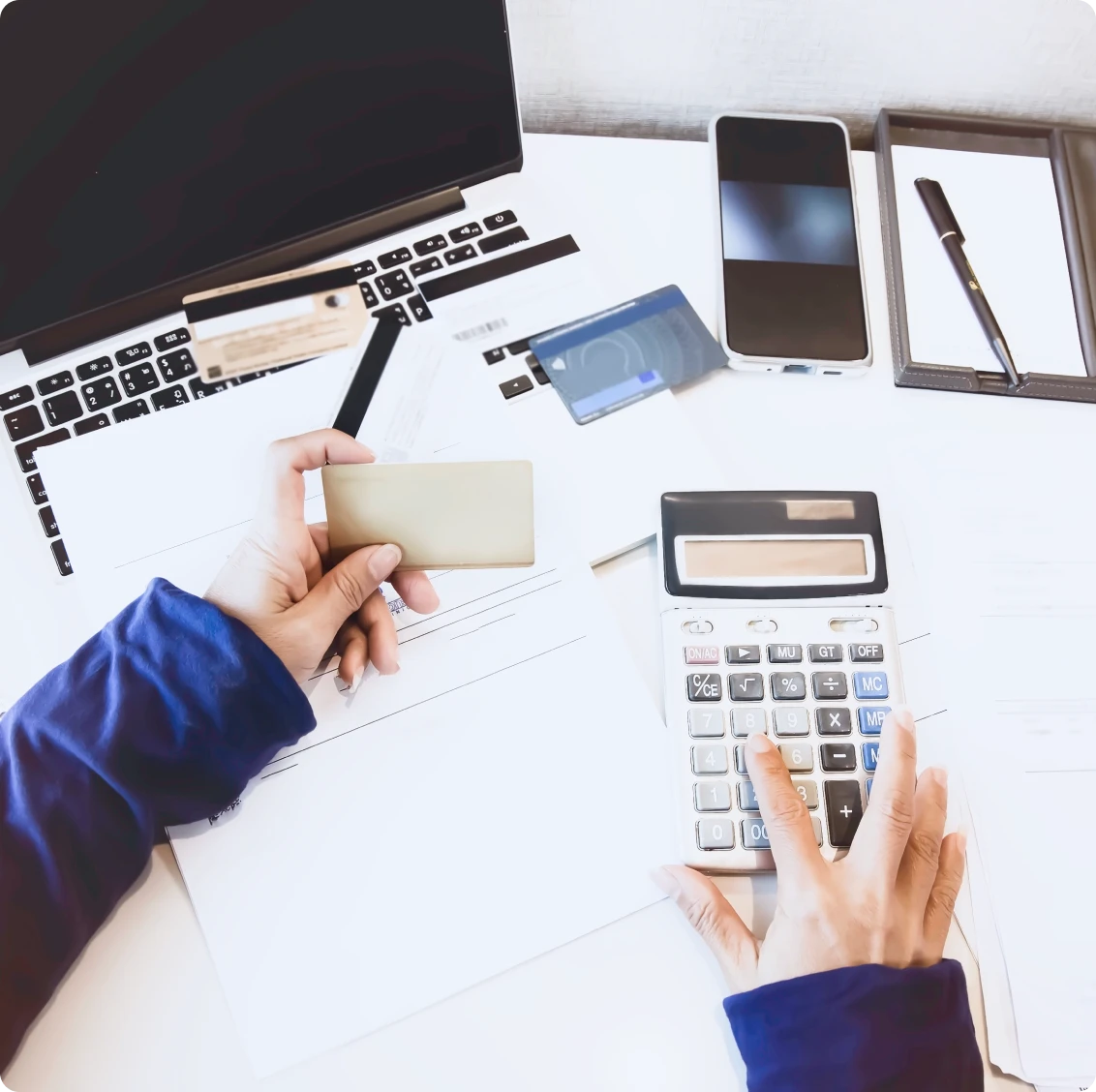 Calculating expenses at a desk